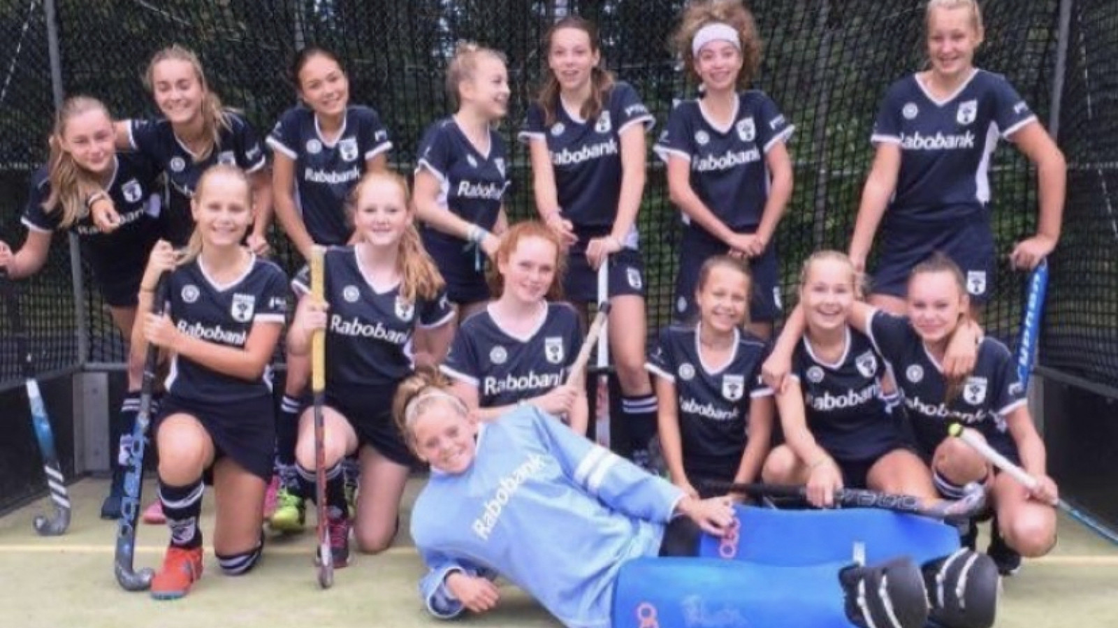 Het hockeyteam met Maxime als keeper